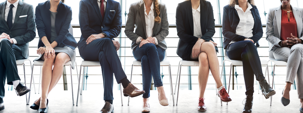 Photo of job applicants seated in waiting room.